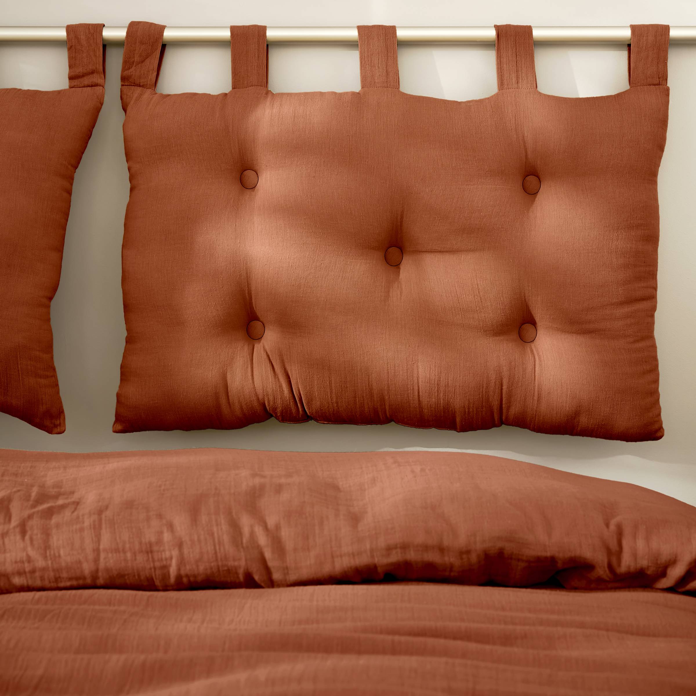 Terracotta muslin headboard